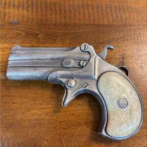 Vintage Silver and Cream Decorative Pistol belt buckle
